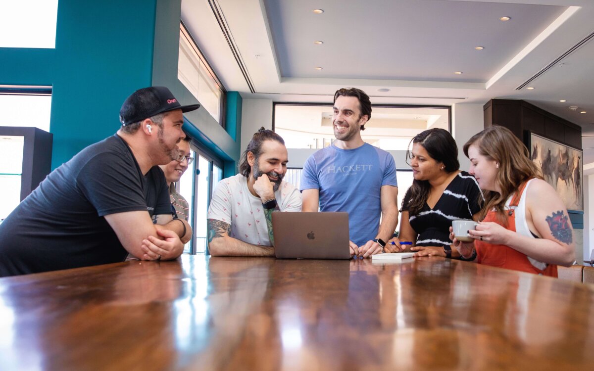 Orum team around computer